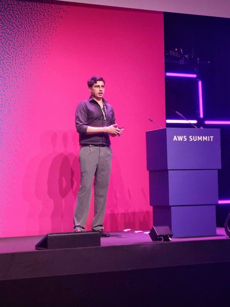 Deven Joshi speaking on stage at AWS Summit Amsterdam